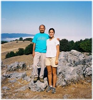 Dinesh, with his arm around Nicole's shoulder, on the Black Mountain summit